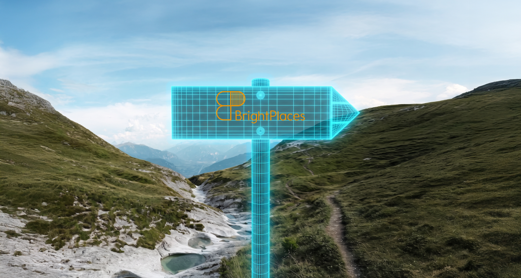 Digitaler Wegweiser mit BrightPlaces-Logo vor alpiner Berglandschaft in Graubünden